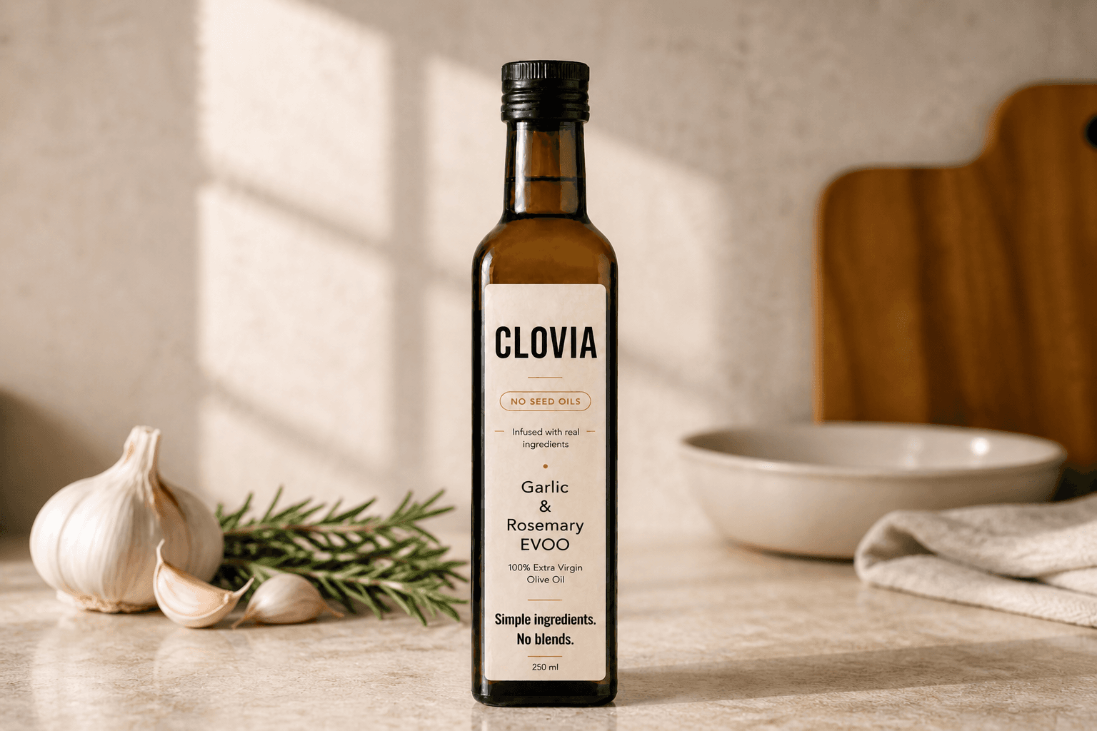 Clovia garlic and rosemary extra virgin olive oil with garlic, rosemary, and cutting board